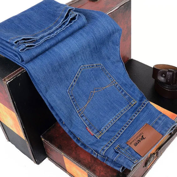 Folded denim jeans, pocket detail